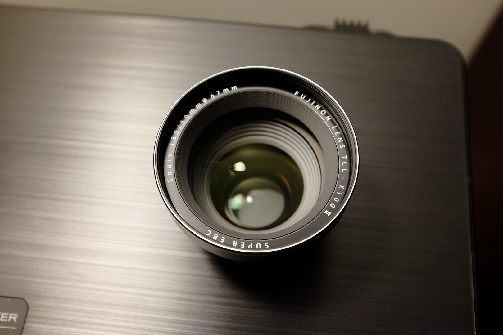 Fuji TCL-X100 II lens overhead, showing the lens markings.