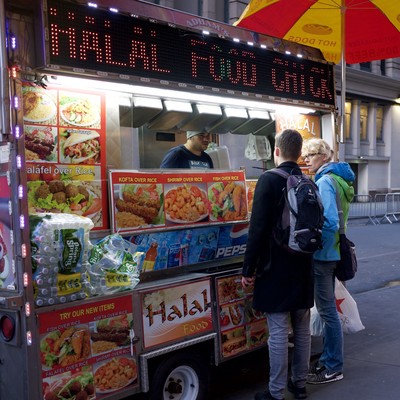Travelers grabbing a bite of Halal Cart on Passover.
